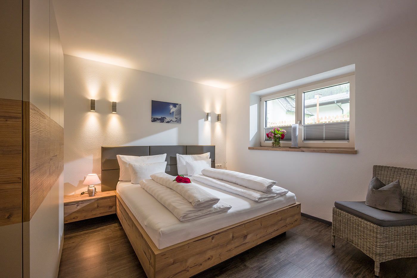 A photo of the apartment bedroom with a double bed and a window