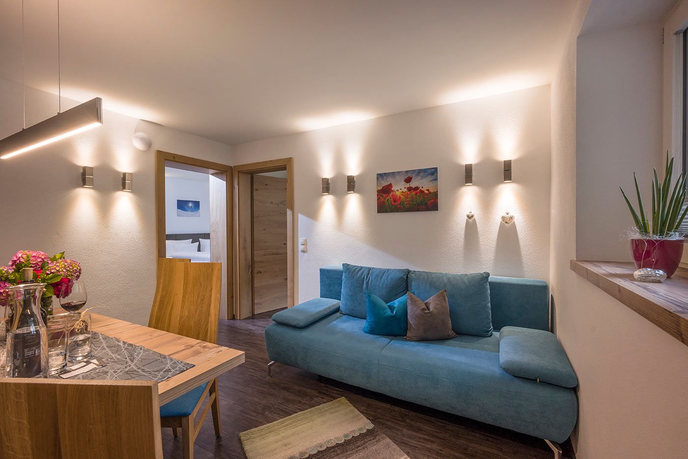 A photo of a blue sofa next to a table