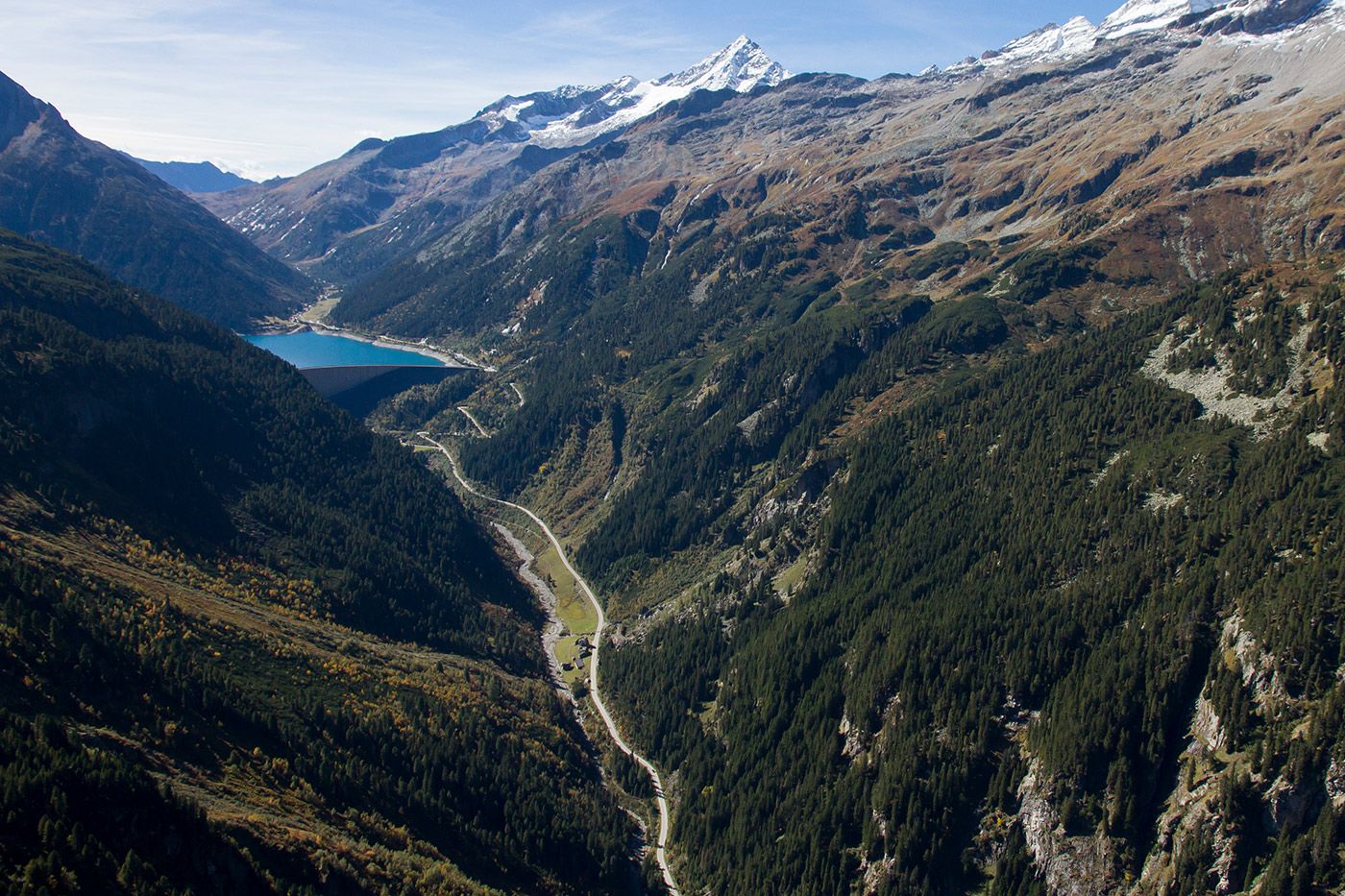 Schlegeis reservoir and alpine road with mountain panorama of the Zillertal Alps